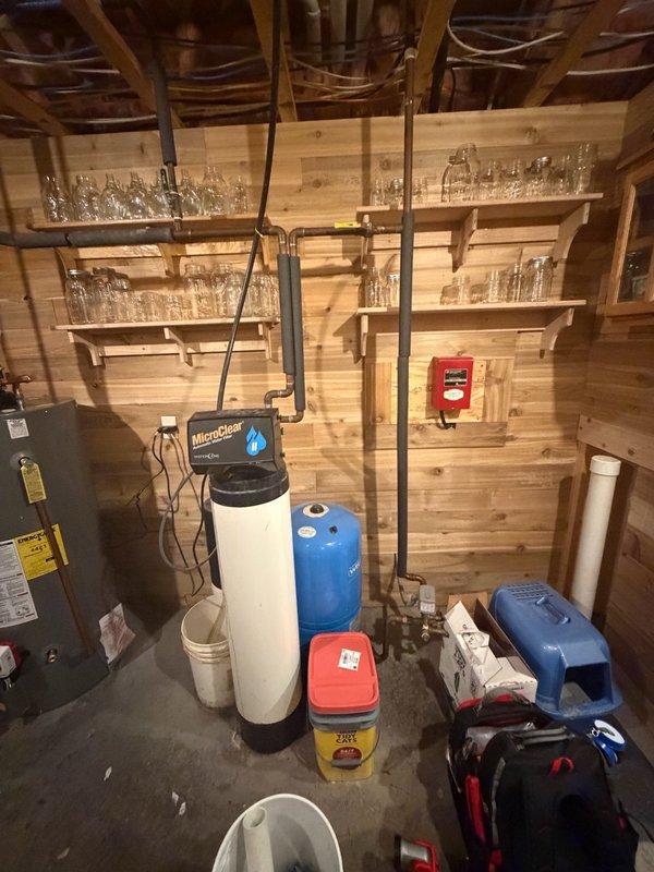 Completed installation of customer-supplied gas water heater in basement utility area. Technician arrived before noon as scheduled and provided courtesy call en route. Connected new unit to existing copper supply lines and gas piping, ensuring proper integration with the home's water treatment system including the MicroClear water softener and pressure tank. All connections were tested for leaks and proper operation upon completion.
