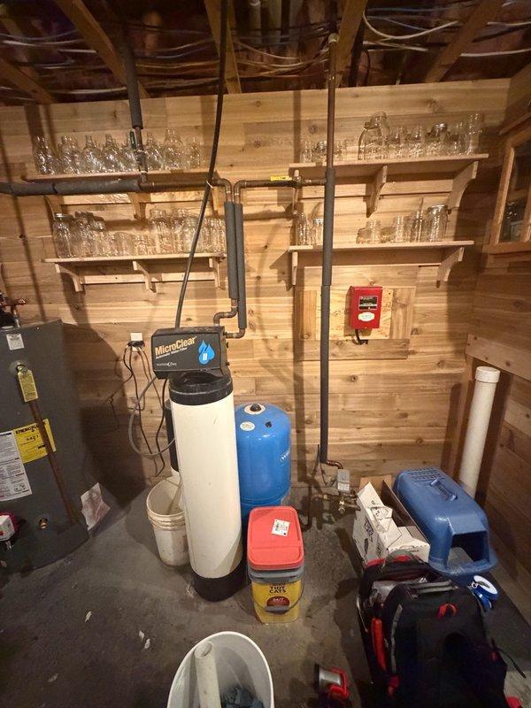 Completed installation of customer-supplied gas water heater in basement utility area. Technician arrived before noon as scheduled and provided courtesy call en route. Connected new unit to existing copper supply lines and gas piping, ensuring proper integration with the home's water treatment system including the MicroClear water softener and pressure tank. All connections were tested for leaks and proper operation upon completion.