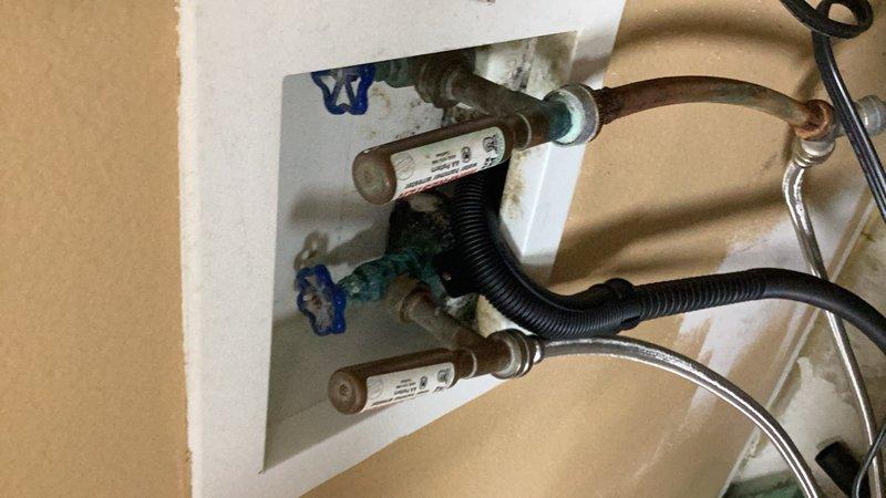 Completed comprehensive plumbing inspection of recently remodeled bathrooms and kitchen. Identified necessary repairs at laundry washer box including replacement of supply hose, air chamber, and potentially the hot water shut-off valve due to corrosion and wear. Estimate provided for washer box valve replacement and associated components.