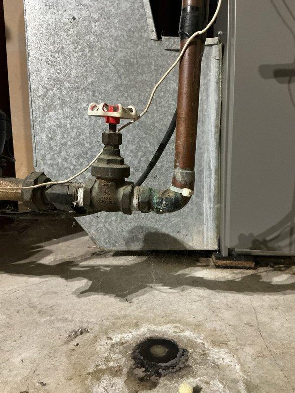 Completed comprehensive plumbing inspection and identified a leaking main water valve requiring immediate replacement. Flushed hot water tank as part of routine maintenance protocol. Removed deteriorated 3/4" gate valve and copper 90-degree elbow fitting from the main water line. Installed new 3/4" brass ball valve with red handle, making proper connections to existing copper piping. Tested all connections and verified no leaks present. All plumbing systems confirmed operational and functioning properly upon completion.