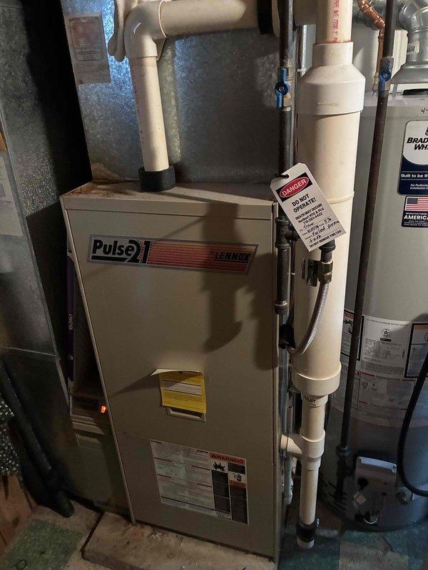 Completed annual AC tune-up with no issues found on cooling system. Performed preventive maintenance inspection on 1994 Lennox Pulse furnace and conducted pressure test, which revealed a loss of approximately 1.5 PSI over 10 minutes, indicating a heat exchanger leak. Identified green corrosion on secondary heat exchanger and demonstrated findings to homeowner. Due to failed pressure test and visible deterioration, furnace was red-tagged and taken out of service for safety reasons. Coordinated follow-up appointment for equipment replacement consultation.