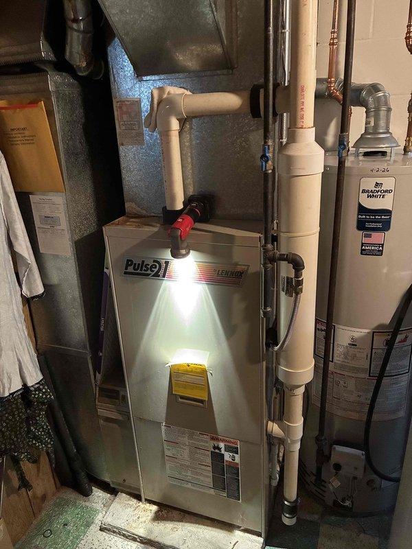 Completed annual AC tune-up with no issues found on cooling system. Performed preventive maintenance inspection on 1994 Lennox Pulse furnace and conducted pressure test, which revealed a loss of approximately 1.5 PSI over 10 minutes, indicating a heat exchanger leak. Identified green corrosion on secondary heat exchanger and demonstrated findings to homeowner. Due to failed pressure test and visible deterioration, furnace was red-tagged and taken out of service for safety reasons. Coordinated follow-up appointment for equipment replacement consultation.