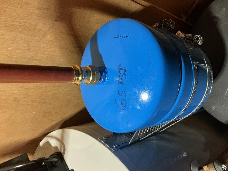 Responded to no hot water complaint and diagnosed malfunctioning tanked water heater that was cycling on and immediately shutting off, indicating a failed safety control or thermostat issue. Inspected unit in unfinished basement utility area, confirmed ignition failure pattern, and evaluated overall system condition including associated plumbing connections and pressure tank. Provided customer with detailed estimate for complete water heater replacement due to age and repair cost considerations.