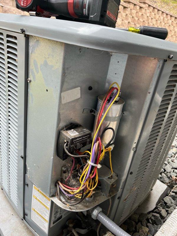 Performed comprehensive AC tune-up on 8-year-old system with no customer concerns reported. Discovered air filter significantly plugged and temporarily replaced with 16x25x5 filter from stock; indoor blower and evaporator coil found clean with proper condensate drainage. Inspected outdoor condenser unit, verified all components clean, and confirmed electrical readings within manufacturer specifications including capacitor, contactor, and wiring connections. Conducted operational testing with 15-minute runtime, verified system performance with temperature split exceeding 18°F across evaporator coil. Recommended permanent filter replacement during scheduled fall furnace inspection to coordinate with annual maintenance routine. System operating properly with no deficiencies requiring immediate attention.