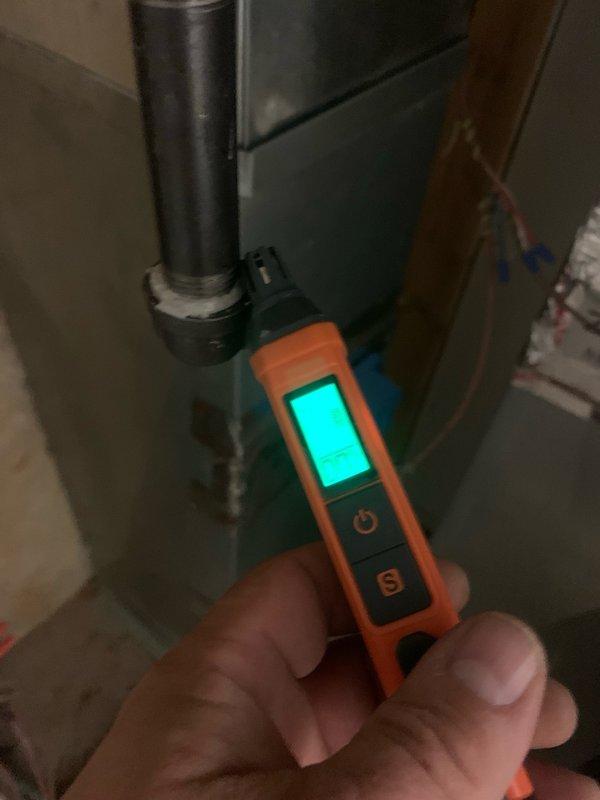 Responded to reports of natural gas odor in mechanical room of 11-year-old furnace system. Performed comprehensive inspection of gas supply lines, fittings, and connections using combustible gas detector. Identified two active leaks: one at the main ball valve connection and a second at the drip leg assembly. Tightened loose connections at ball valve to manufacturer specifications and replaced defective 1/2" cap on drip leg. Conducted leak verification testing on all gas connections and fittings to confirm repairs. Cycled furnace through complete heating operation to verify system functionality and monitor for any additional gas migration. All connections tested leak-free and system returned to normal operation.