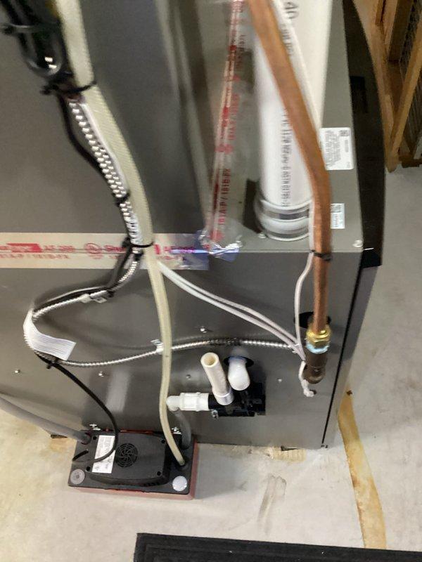 Completed code correction callback on residential furnace installation. Documented existing rigid transition piece on plenum that requires replacement with fabric vibration isolation transition per code requirements. Coordinated fabrication of proper flexible transition piece for installation team to replace rigid connection, ensuring compliance with vibration isolation standards between furnace and ductwork system.