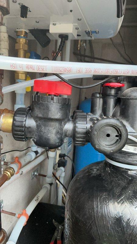 Responded to callback for gas and water leaks identified during previous installation at school facility. Repaired gas leak at TRAC fitting near furnace by replacing section of gas piping and pressure testing for integrity. Addressed water leak on newly installed water softener by replacing defective bypass valve assembly. Modified existing plumbing lines in basement where commercial dishwasher was previously located, cutting pipes lower to accommodate toe kick clearance requirements and properly capping all openings. All systems tested and verified operational with no leaks detected upon completion.