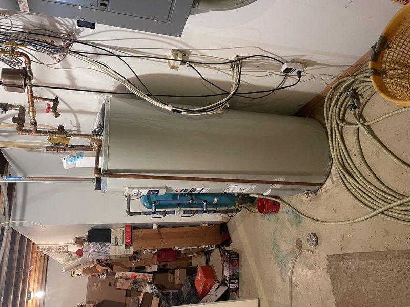 Responded to no cooling complaint on geothermal heat pump system. Upon arrival, found thermostat water temperature control incorrectly set to heating mode instead of cooling mode, preventing system from operating. Corrected thermostat settings and cycled unit multiple times to verify proper operation. Performed complete cooling season tune-up and maintenance inspection per rewards membership agreement. Checked refrigerant pressures and temperature differentials on geothermal unit - all readings within manufacturer specifications. Inspected air handler, ductwork connections, and associated components. System tested and left in proper working order with cooling function restored.