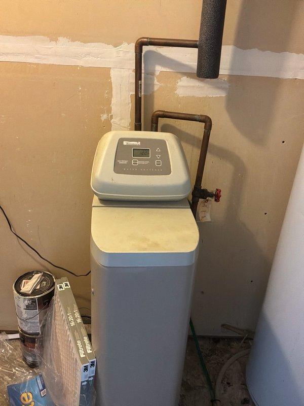 Conducted comprehensive plumbing estimate for water heater replacement in utility room with existing water softener system. Assessed current water heater condition, evaluated copper piping configuration, and documented existing plumbing infrastructure including water softener connections and valve placements. Provided recommendations for water heater replacement options and identified opportunities for general plumbing system improvements throughout the property.