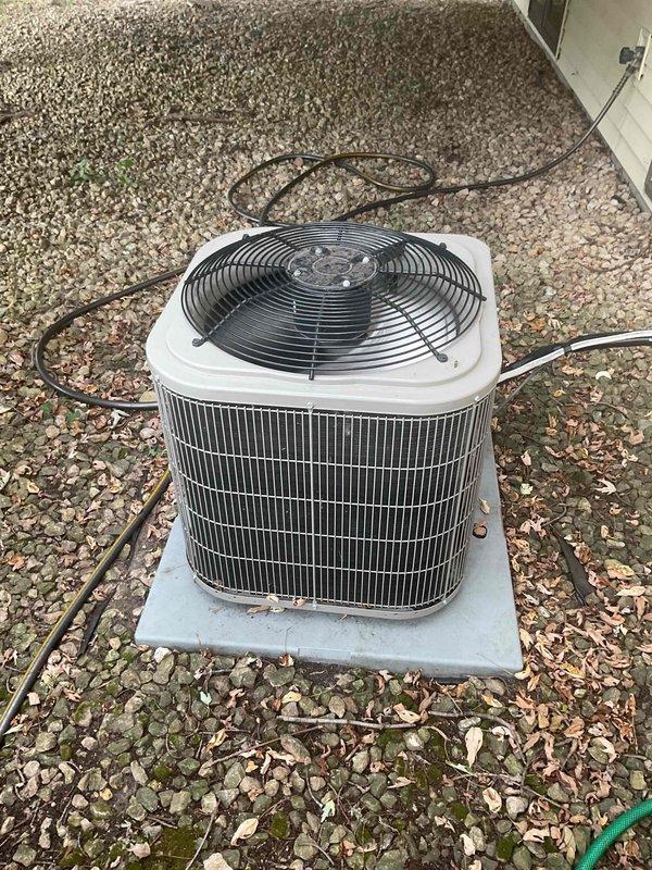 Performed comprehensive air conditioning tune-up and maintenance on Lennox HVAC system. Verified system performance with temperature differential measuring 18 degrees, confirmed refrigerant pressures within normal operating range, and replaced dirty air filter. System tested and operating properly with normal cooling function.