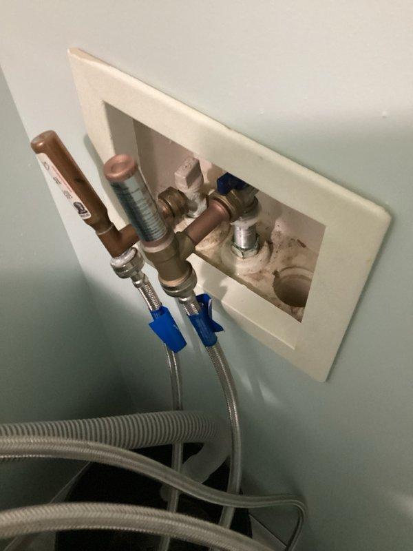 Responded to a water leak at the washing machine supply line. Upon inspection, identified a failed hammer arrestor as the source of the leak at the laundry hook-up connections. Removed the defective hammer arrestor and installed a new replacement unit. Verified all connections were secure, tested the water supply lines for proper operation, and confirmed no additional leaks were present. System restored to full functionality.