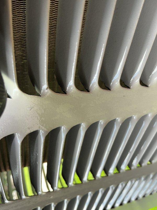 Completed comprehensive AC maintenance tune-up on 2-year-old system. Inspected condenser coil fins, verified proper airflow and heat exchange efficiency, documented equipment condition with photographs. No issues identified; system operating within normal parameters.