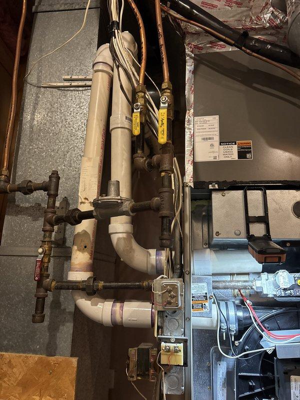 Completed comprehensive maintenance on two 18-year-old, 90% efficiency furnaces as part of recurring heating system agreement. Inspected and verified proper operation of thermostats, indoor air handlers, filters, drains, blower motors, inducer motors, capacitors, and electrical wiring on both units. Confirmed temperature splits, igniter function, and flame sensor operation within normal parameters. Conducted safety inspections including CO level testing with satisfactory results. Heat exchanger and gas pressure inspections could not be fully completed due to limited access space and equipment constraints, with homeowner acknowledgment. 

Addressed humidifier malfunction on both systems where solenoid operation was audible but no water flow detected. Confirmed water supply valves open and operational. Discovered debris obstruction in water supply hoses causing flow restriction. Cleared debris from hoses and restored proper water flow to humidifiers. Recommended and received approval for