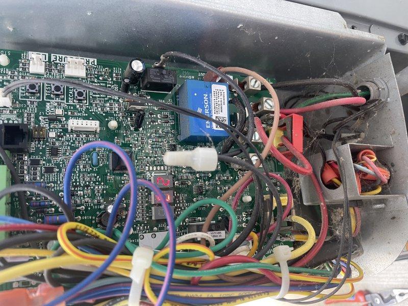 Responded to callback for air conditioning unit experiencing intermittent operation issues. Found unit locked out on L2 high-pressure safety. Reset system and confirmed condenser motor operation, however customer-provided video evidence showed motor failing to start properly on previous cycles. Inspected control board and condenser motor assembly. Based on diagnostic findings and documented failure pattern, recommended replacement of both condenser motor and control board to prevent recurring lockouts. Photographed existing control board with wiring connections and condenser motor assembly for documentation. Submitted parts request for pricing and availability of replacement components.