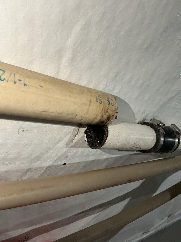Responded to kitchen sink drainage issue caused by grease accumulation in the kitchen waste line. Accessed the drainage system and deployed small rigid snake through the cleanout to clear the blockage. Successfully restored proper drainage flow and verified system operation upon completion.