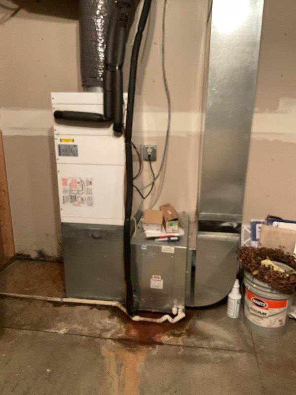 Performed comprehensive tune-up service on two air conditioning systems. Inspected both air handlers and cleared condensate drain lines. Addressed significant water accumulation on mechanical room floor by thoroughly flushing and clearing the condensate drain system on the unit in the mechanical room. Drain flow improved after flushing but continues to show slow drainage characteristics.

Washed both condenser units and performed full system diagnostics. Tested all capacitors and electrical components. Found capacitor on the older system reading 42.2 mfd against a rated 45 mfd specification, which remains within acceptable operating tolerance. Measured temperature drop across both systems at 29°, which is normal for high-velocity applications.

Due to the high-static, high-velocity system design, recommend using minimal-restriction air filters to reduce moisture accumulation at the coil. This drainage issue appears to be a long-standing characteristic of the system design rather than a