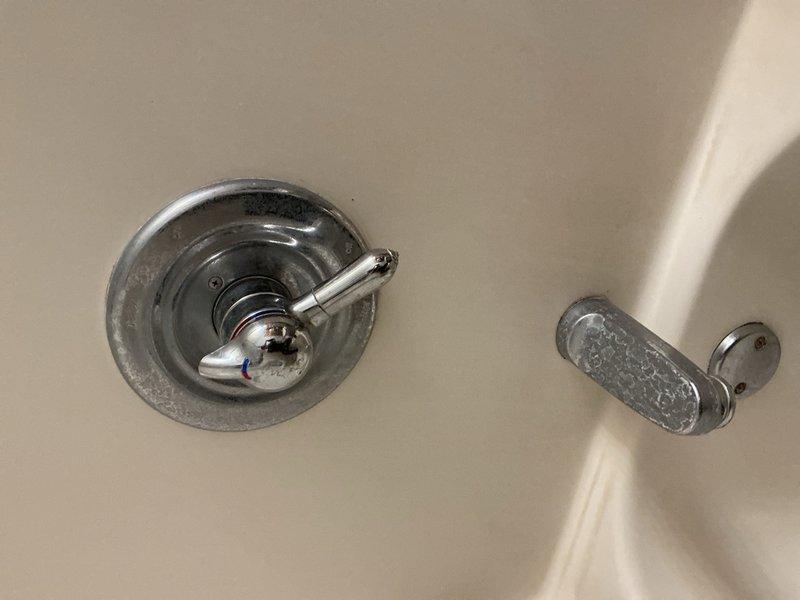 Responded to service call for leaking bathroom faucet and tub spout. Successfully replaced worn cartridge and gaskets in the shower valve control to eliminate leak. Both fixtures are now functioning properly with no water leakage detected upon completion of repairs.