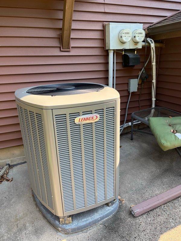 Performed comprehensive AC tune-up on 8-year-old Lennox system with no customer concerns reported. Replaced dirty air filter with customer-supplied unit, verified blower and evaporator coil were clean with proper drainage, and confirmed all electrical components at outdoor unit were within manufacturer specifications. Cleaned condenser coil, tested system operation for 15 minutes achieving over 20° temperature drop, and confirmed all components functioning normally.