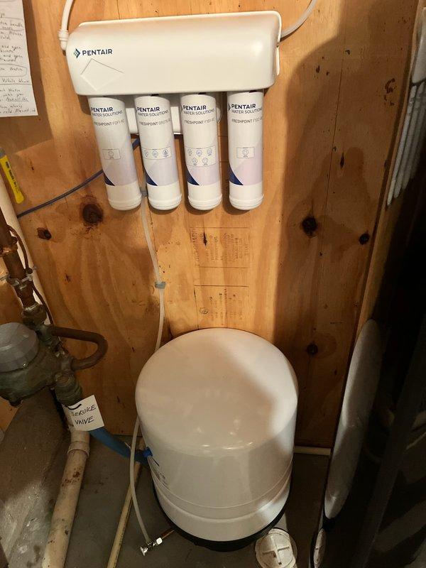 Responded to service call for Pentair reverse osmosis system experiencing reduced water flow approximately one month after installation. Verified holding tank pressure at 7 psi, confirming proper specification. Replaced all system filters to restore adequate water pressure and flow rate at dispensing faucet, as customer reported system functioned properly until recent decline in performance.
