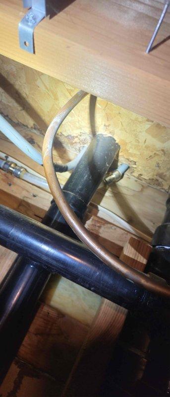 Responded to water leak originating from second floor and affecting first floor due to deteriorated piping installed in the 1980s. Immediately shut off main water line to stop active leak and prevent further water damage. Completed necessary repairs to resolve the leak issue and restore proper function to the plumbing system.