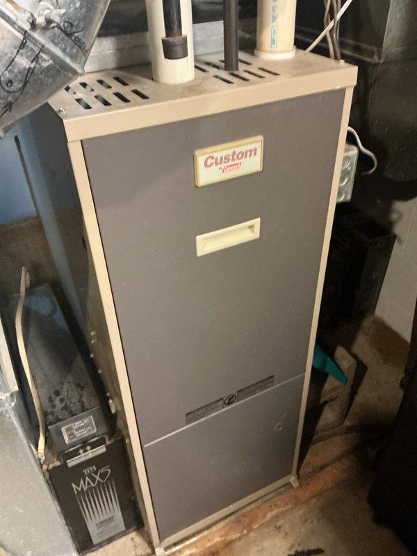 Completed comprehensive maintenance on aging HVAC system including 27-year-old Custom Comfort furnace and 21-year-old air conditioning unit. Performed thorough cleaning of critical components including dual capacitor, draft inducer motor, burners, and blower wheel assembly. Inspected and serviced control board, verified proper operation of all safety controls, and assessed system performance with comfort advisor evaluation. Replaced air filter and confirmed adequate airflow throughout system. All equipment operational at time of service completion, though advanced age of units noted for future consideration.