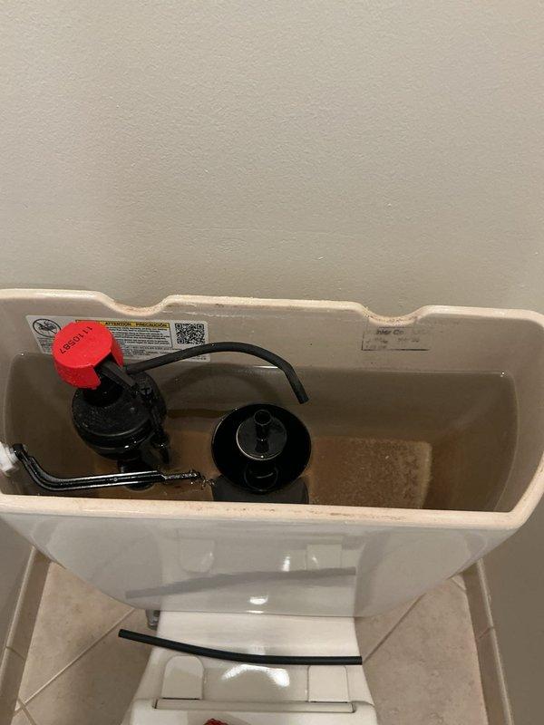 Responded to a call for a toilet leaking during flush cycles. Upon inspection, removed the tank lid and identified that the refill tube had disconnected from the fill valve to the flush valve overflow tube, causing water to spray outside the tank. Removed and replaced the defective fill valve refill tube, reconnected it properly to the overflow tube, and tested the toilet through multiple flush cycles to verify proper operation and confirm no leaks were present.