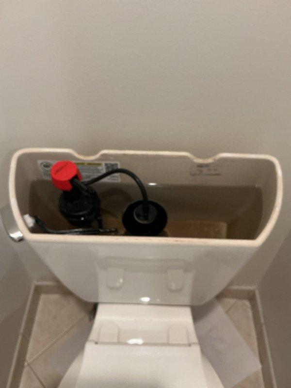 Responded to a call for a toilet leaking during flush cycles. Upon inspection, removed the tank lid and identified that the refill tube had disconnected from the fill valve to the flush valve overflow tube, causing water to spray outside the tank. Removed and replaced the defective fill valve refill tube, reconnected it properly to the overflow tube, and tested the toilet through multiple flush cycles to verify proper operation and confirm no leaks were present.