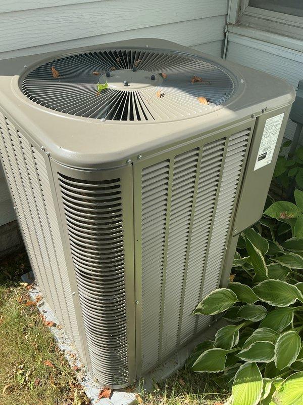 Completed comprehensive AC tune-up on a 2-year-old Lennox ML17XC1 condenser unit. Performed standard maintenance protocol including inspection of electrical connections, refrigerant levels (HFC-410A factory charge verified at 5 lbs 2 oz), condenser coil cleaning, and removal of debris from top grille and surrounding area. All system components operating within manufacturer specifications with no issues identified. Unit tested and confirmed operational.