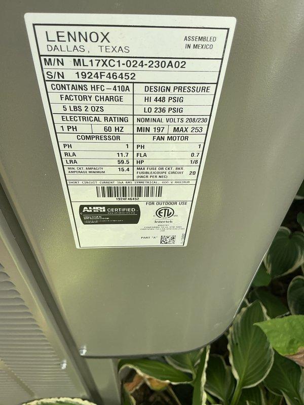 Completed comprehensive AC tune-up on a 2-year-old Lennox ML17XC1 condenser unit. Performed standard maintenance protocol including inspection of electrical connections, refrigerant levels (HFC-410A factory charge verified at 5 lbs 2 oz), condenser coil cleaning, and removal of debris from top grille and surrounding area. All system components operating within manufacturer specifications with no issues identified. Unit tested and confirmed operational.