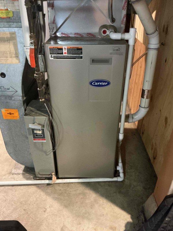 Performed comprehensive maintenance inspection on 18-year-old Carrier furnace and 7-year-old Lennox air conditioning system. Furnace evaluation revealed satisfactory ignition and flame safety operation, clean filter, functional control board and gas valve, but identified failed heat exchanger with elevated temperature rise, requiring safety shutdown of heating unit. Air conditioning inspection showed operational contactor, weak compressor capacitor, proper refrigerant charge, and acceptable 18-degree temperature drop; performed condenser coil rinse to maintain system efficiency. Reviewed all available options with homeowner and coordinated service advisor appointment to address furnace replacement needs.