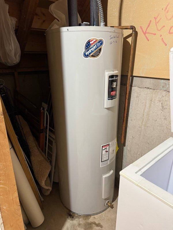 Responded to reported water heater leak and water softener malfunction at property being prepared for sale. Upon inspection, confirmed water heater was not actively leaking but discovered significant rust corrosion on hot water outlet connection. Manually initiated regeneration cycle on water softener unit, which completed successfully and appeared to be functioning within normal operating parameters. Documented rusted hot water outlet piping on tanked water heater with photographic evidence showing deteriorated copper connections at top of unit. Provided estimates for both component replacement of corroded hot water outlet assembly and full water heater replacement options for homeowner consideration.