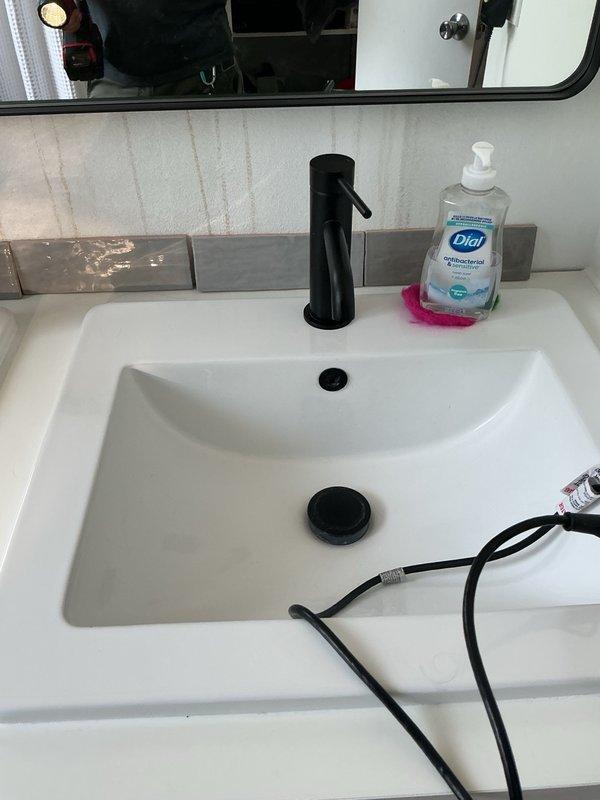 Completed plumbing inspection of residential property in conjunction with scheduled HVAC tune-up service. Diagnosed malfunctioning garbage disposal unit in kitchen sink, determined unit to be non-functional due to age and wear. Provided written estimates for disposal replacement and associated repair options to customer for consideration.