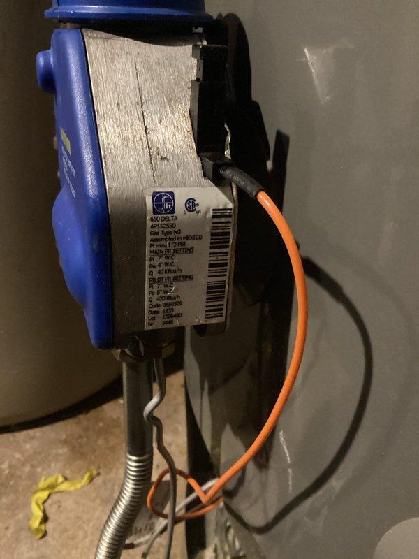 Responded to gas leak complaint at water heater following previous service calls and utility company inspection. Performed comprehensive leak detection testing and confirmed active gas leak at the gas control valve connection point and suspected secondary leak at burner assembly interface. Utility company had previously identified leaking control valve on supply pipe requiring replacement. Unit showed signs of multiple repair attempts with recently replaced gas valve still exhibiting leak issues. Conducted thorough safety inspection of all gas connections, supply piping, and combustion components. Documented leak locations with photographic evidence showing water heater installation, gas valve assembly, and associated electrical safety controls. Recommended immediate repair or replacement of faulty gas control valve and burner assembly to eliminate hazardous gas leak condition and restore safe operation.