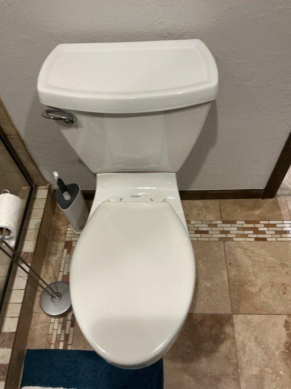Responded to report of toilet running intermittently. Upon inspection, identified leak in toilet tank caused by improperly adjusted flapper chain. Chain length was excessive, causing it to become caught in the flush valve and preventing proper seal. Shortened flapper chain to appropriate length, tested flush mechanism multiple times to ensure proper operation and complete seal. Verified leak was resolved and toilet now functions correctly with no water waste.