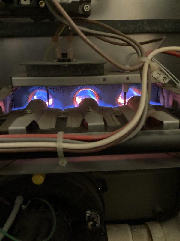 Performed comprehensive tune-up and inspection on a 27-year-old Amana high-efficiency furnace in preparation for home sale inspection. System was experiencing significant noise issues, specifically a loud knocking sound originating from the blower motor assembly.

Conducted thorough safety and operational assessment of all furnace components. Inspected heat exchanger and confirmed safe operation with proper combustion and flame characteristics. Verified burner assembly functioning correctly with appropriate blue flame pattern.

Identified multiple issues during inspection. Discovered blower wheel heavily contaminated with debris and dirt accumulation, causing irregular operation and excessive noise. Found blower motor and wheel assembly improperly supported with styrofoam material, which had been previously installed in an attempt to reduce operational noise. This makeshift support was contributing to system instability and noise generation.

Assessed overall system condition given the