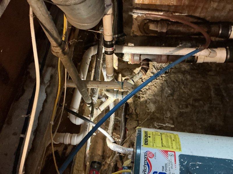 Responded to emergency water line failure in basement area. Upon arrival, shut off main water supply to stop active leak from burst hot water line. Assessed damaged copper piping showing significant corrosion and deterioration. Removed failed section of hot water piping and replaced with new materials. Coordinated with water damage restoration company as requested. Verified all connections were secure, restored water supply, and confirmed system operating properly with no leaks present.