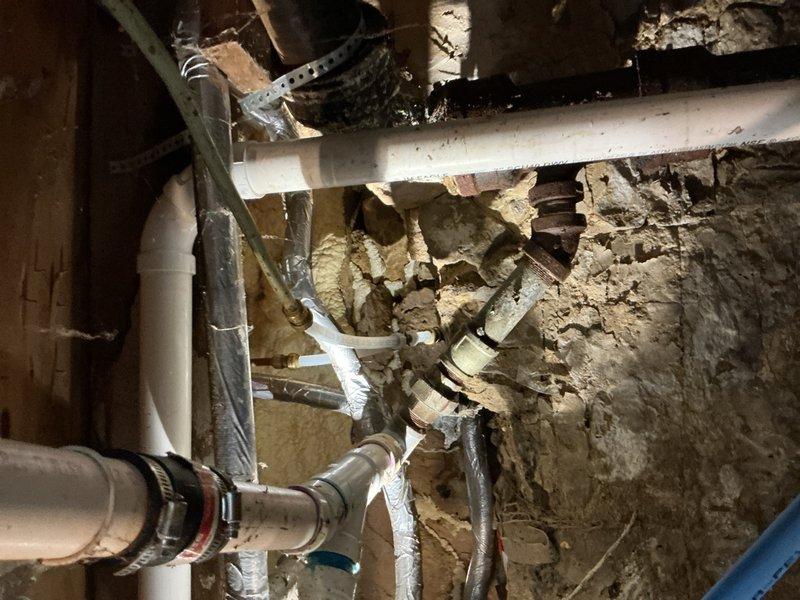 Responded to emergency water line failure in basement area. Upon arrival, shut off main water supply to stop active leak from burst hot water line. Assessed damaged copper piping showing significant corrosion and deterioration. Removed failed section of hot water piping and replaced with new materials. Coordinated with water damage restoration company as requested. Verified all connections were secure, restored water supply, and confirmed system operating properly with no leaks present.