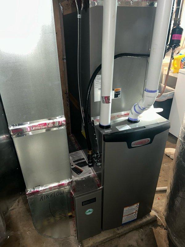 Completed comprehensive air conditioning maintenance inspection on Lennox HVAC system. Performed full system evaluation including thermostat operation verification, air filter assessment, blower assembly inspection, outdoor coil examination, electrical component testing, contactor and capacitor analysis, condensate drain check, refrigerant performance evaluation, and temperature split measurements. Inspected ECM control board and all electrical connections for proper operation. All system readings confirmed within manufacturer specifications with no mechanical defects or safety concerns identified. System operating at optimal performance levels. Recommended maintaining regular filter changes and keeping indoor and outdoor coils clean to ensure continued efficient operation and prevent future issues.