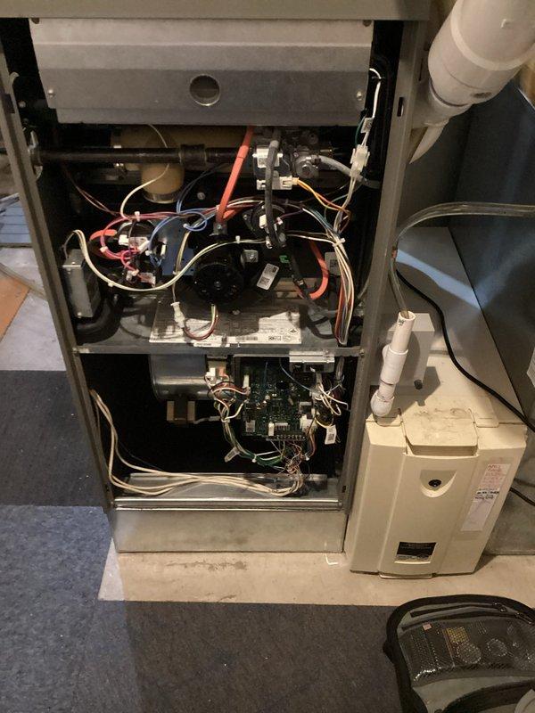 Completed scheduled maintenance tune-up on residential furnace and air conditioning system as part of recurring heating visit agreement. Performed comprehensive inspection of gas furnace components including blower motor assembly, electrical connections, gas valve, control board, and burner operation. Checked all safety controls and verified proper system functionality. Inspected Honeywell humidifier unit and associated ductwork connections. Noted unit requires specialized AprilAire accordion-style air filter; current filter size documented for future ordering as this particular model may not be in standard stock inventory. Examined condensate pump operation and PVC drainage system for proper function. Verified all electrical wiring connections throughout upper and lower furnace compartments, including multi-colored wire harnesses to motor assembly and control systems. All equipment operating within normal parameters with no immediate service concerns identified. System performing effi