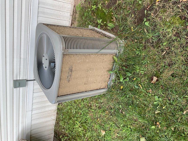 Performed comprehensive air conditioning maintenance on front residential unit. Equipment had not been serviced since installation three years prior, resulting in completely plugged condenser coil that was restricting airflow and reducing system efficiency. Thoroughly washed condenser coil to remove accumulated dirt, debris, and organic matter. Inspected and verified operation of all system components including compressor, fan motor, capacitor, and refrigerant lines. Customer enrolled in maintenance membership program for ongoing preventive care.