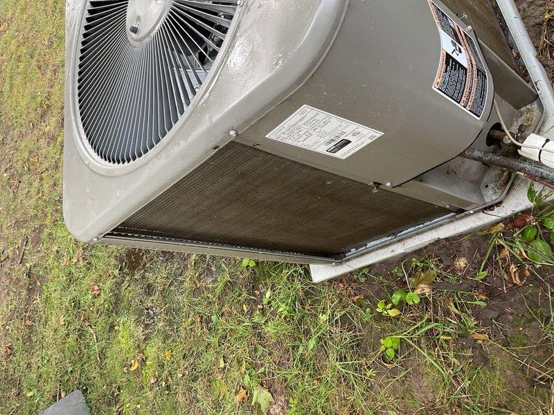 Performed comprehensive air conditioning maintenance on front residential unit. Equipment had not been serviced since installation three years prior, resulting in completely plugged condenser coil that was restricting airflow and reducing system efficiency. Thoroughly washed condenser coil to remove accumulated dirt, debris, and organic matter. Inspected and verified operation of all system components including compressor, fan motor, capacitor, and refrigerant lines. Customer enrolled in maintenance membership program for ongoing preventive care.