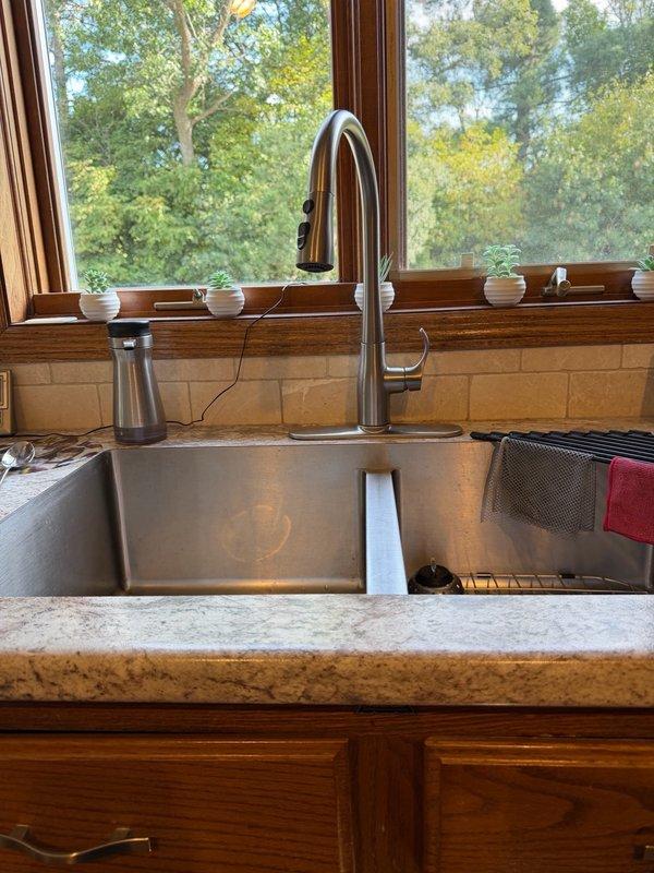 Responded to water leak under kitchen sink. Upon inspection, identified the basket strainer as the source of the leak. Removed the failed basket strainer and installed a new replacement unit. Tested the repair to confirm proper seal and verified no active leaks remain. System restored to full functionality.