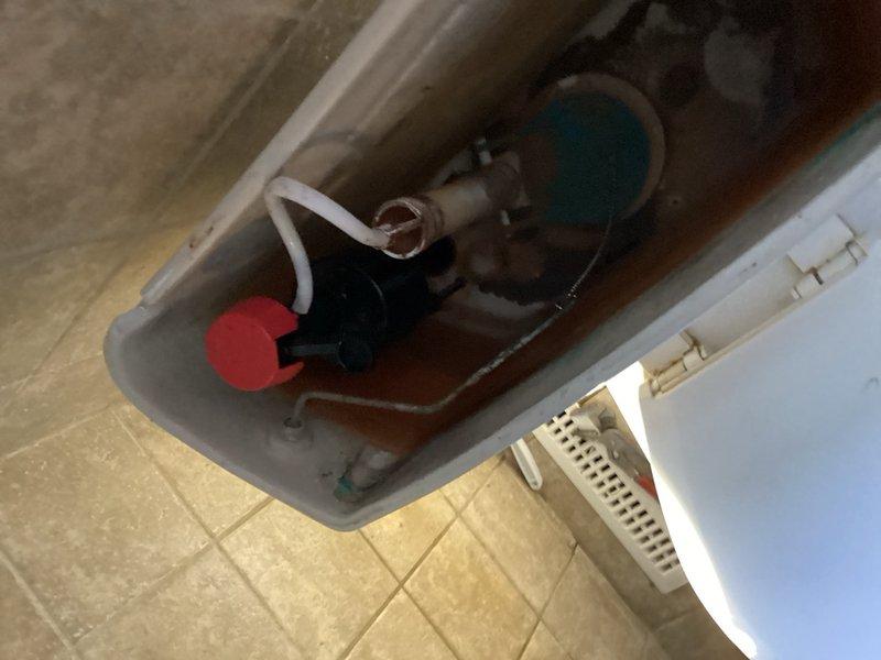 Responded to a service call for a toilet with multiple issues including water pooling around the base and a malfunctioning flush mechanism. Upon inspection, identified a small leak in the supply line and a faulty fill valve causing the handle to malfunction and preventing proper sealing. Replaced the defective supply line and fill valve, restoring proper operation and eliminating all leaks.