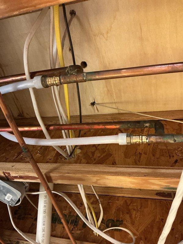 Responded to a water leak under the bathroom sink in a main level half bath. Upon inspection, determined the existing supply lines were compromised and required replacement. Ran new PEX water supply lines into the cabinet, installed new shut-off valves and supply lines to the fixture. Pressure tested all connections and verified no leaks were present upon completion.