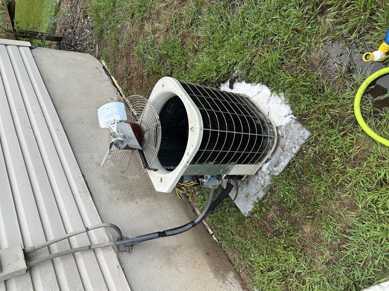 Completed annual air conditioning tuneup on 15-year-old Bryant system. Performed comprehensive maintenance including testing system operation, inspecting secondary heat exchanger, removing mice from blower compartment, testing blower capacitor, clearing condensate drain, and washing condenser coil. Found both compressor and blower capacitors reading slightly below specification and provided replacement pricing. Additionally provided pricing for inducer motor replacement due to previous noise concerns reported during winter operation, though unit currently operating quietly.