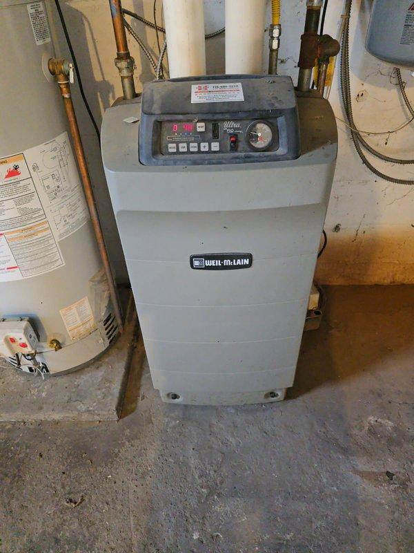 Responded to a duplex property for scheduled boiler preventative maintenance on two Weil-McLain units. Upon arrival, found first boiler completely inoperable with error code displayed and second boiler starting but failing to modulate up to heating temperature. 

Diagnostic testing revealed the non-operational boiler had a severely deteriorated venturi component that was burned out, rotted, and perforated with multiple holes. This unit also requires a complete maintenance/gasket kit and heat exchanger cleaning to restore proper function. 

On the second boiler that would start but not heat properly, discovered the heat exchanger was completely plugged with debris and buildup, preventing proper modulation and heat transfer. This unit also requires a maintenance/gasket kit for full restoration.

Due to both boilers being non-functional upon arrival, converted the scheduled preventative maintenance visit to a service call. Documented all findings with photographic evidence showing the Wei