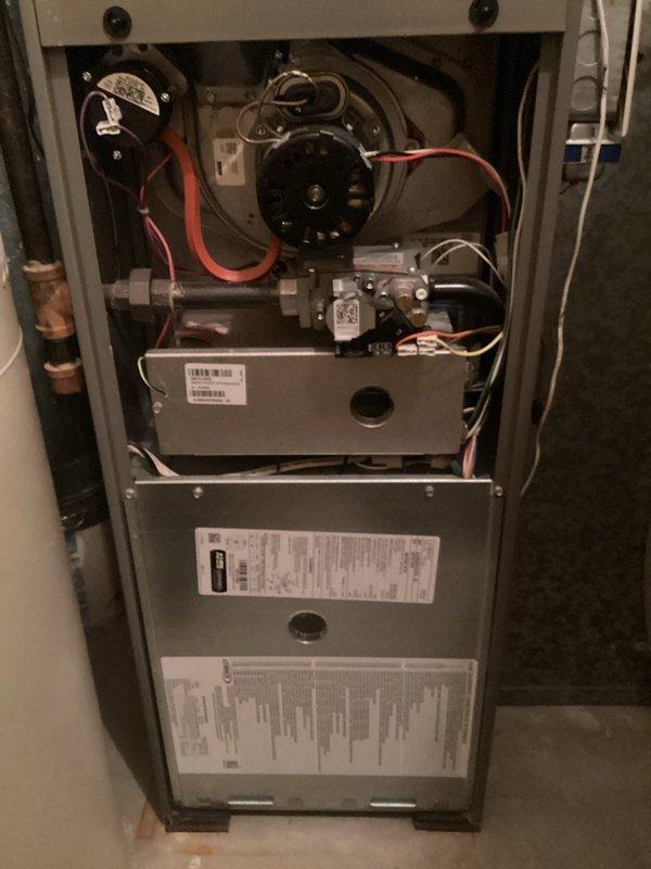 Completed comprehensive tune-up of residential furnace and air conditioning system, verifying temperature splits were within acceptable ranges for both units. Cleaned flame sensor to ensure optimal combustion, confirmed gas pressures met manufacturer specifications at high and low settings, verified all electrical connections were secure, and cleaned excessively dirty outdoor condenser unit to restore proper airflow and efficiency. Inspected UV light air purification system per customer request and identified burnt bulb requiring replacement, provided quote for bulb replacement, and confirmed both HVAC systems operating in good working condition following service.