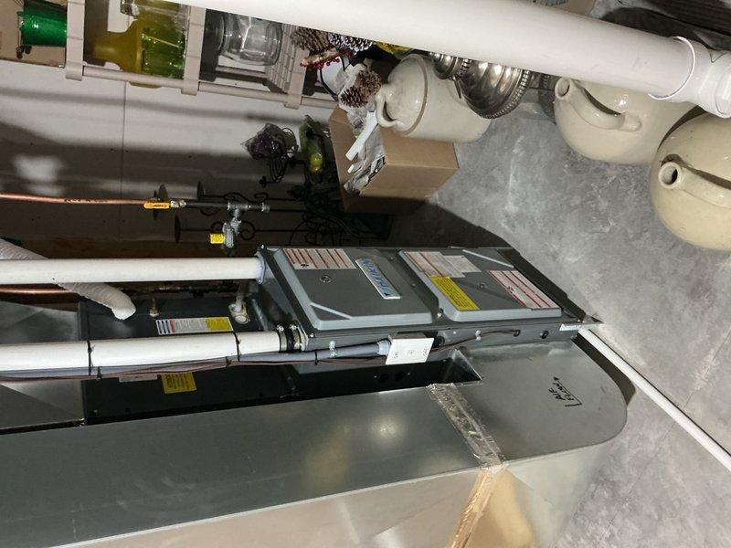 Responded to no hot water call and diagnosed a leaking water heater tank. Removed failed unit and installed new 50-gallon electric water heater with proper electrical connections, water supply lines, and code-compliant temperature and pressure relief valve discharge piping.