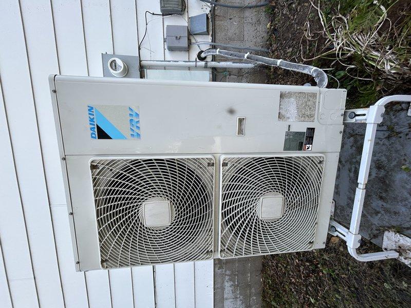 Completed comprehensive air conditioning maintenance and inspection on a Daikin VRF heat pump system with dual indoor air handlers. Performed full AC tuneup including system performance verification, airflow assessment, and operational testing. All cooling components operating within normal parameters at time of service. Unable to complete heating system maintenance due to outdoor ambient temperature of 95°F preventing heat mode activation, likely due to outdoor temperature sensor lockout protection. Captured documentation of equipment make, model, and serial number information. Follow-up visit scheduled to perform furnace tuneup and heating system maintenance once outdoor temperatures drop to allow proper heat mode operation and testing.