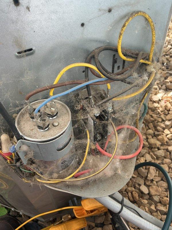 Responded to no cool call on 16-year-old residential air conditioning system experiencing inconsistent cooling performance and history of freeze-ups. Upon arrival, confirmed system was cycling improperly with temperature swings between over-cooling and insufficient cooling. 

Performed comprehensive diagnostic testing of outdoor condensing unit. Identified failed dual run capacitor as primary failure point. Measured amperage draw on compressor and condenser fan motor. Compressor operating at elevated amperage indicating internal wear and imminent failure. Condenser fan motor exhibiting oil leakage from bearings and producing abnormal operating sounds consistent with motor failure. Verified refrigerant charge within manufacturer specifications with no leaks detected.

Replaced failed capacitor to restore immediate system operation. Replaced condenser fan motor to address secondary failure. Tested all electrical connections and confirmed proper voltage supply. Cycled system through multi